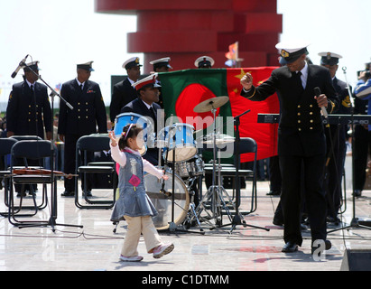 Members of the U.S. navy`s military band watch a performance in Qingdao, China. China`s People`s Liberation Army and Navy held Stock Photo